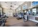 Community gym with mirrored walls, ceiling fans, weight machines and cardio equipment at 8433 Corkfield Ave, Orlando, FL 32832