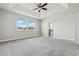 Large main bedroom with carpet, ceiling fan, bathroom and nice view at 8433 Corkfield Ave, Orlando, FL 32832