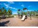 A well-maintained playground area with a slide, climbing structures, and benches at 8433 Corkfield Ave, Orlando, FL 32832