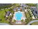 Aerial view of a large community pool with plenty of chairs and tables for relaxing at 8433 Corkfield Ave, Orlando, FL 32832