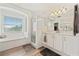 Bright bathroom showcasing a soaking tub, glass shower, and vanity with modern fixtures at 848 Jadestone Cir, Orlando, FL 32828