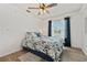 Bright bedroom featuring hardwood floors, natural light, and modern ceiling fan at 848 Jadestone Cir, Orlando, FL 32828