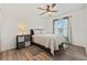 Bedroom features hardwood floors, a ceiling fan, and a window with natural light at 848 Jadestone Cir, Orlando, FL 32828