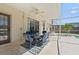 Inviting covered patio featuring a ceiling fan and comfortable seating next to the screened pool at 848 Jadestone Cir, Orlando, FL 32828