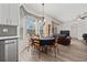 Cozy dining area with a table for six next to the kitchen at 848 Jadestone Cir, Orlando, FL 32828