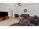 Comfortable living room featuring a ceiling fan and decorative wall mirror at 848 Jadestone Cir, Orlando, FL 32828