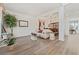 Elegant living room with hardwood floors, neutral decor, and plenty of natural light at 848 Jadestone Cir, Orlando, FL 32828