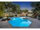 Aerial view of a backyard with a sparkling pool, patio area, and lush landscaping at 851 Georgia Ave, Winter Park, FL 32789