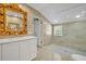 Beautiful bathroom featuring an ornate mirror, custom vanity, and frameless glass shower at 851 Georgia Ave, Winter Park, FL 32789