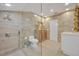 Elegant bathroom with a walk-in shower, tiled walls, and custom vanity at 851 Georgia Ave, Winter Park, FL 32789