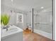 Well-lit bathroom featuring tile floors, double sinks, and a shower/tub combo at 851 Georgia Ave, Winter Park, FL 32789