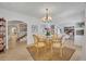 Charming dining room featuring a glass table, unique chandelier, arched doorways, and stylish decor, perfect for gatherings at 851 Georgia Ave, Winter Park, FL 32789