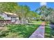 Charming home featuring a well-manicured lawn and a red brick walkway at 851 Georgia Ave, Winter Park, FL 32789