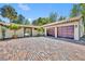 Property featuring a motor court with brick pavers and an attached two-car garage at 851 Georgia Ave, Winter Park, FL 32789