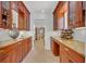 Hallway features beautiful cabinetry, counter tops, wooden accents, and ample storage for dishes, glassware, and wine at 851 Georgia Ave, Winter Park, FL 32789