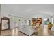 Bright living room featuring wood floors, neutral furniture, French doors, and artistic decor, perfect for entertaining at 851 Georgia Ave, Winter Park, FL 32789