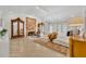 Spacious main bedroom featuring light wood floors, ample seating, and elegant decor, enhanced by natural light at 851 Georgia Ave, Winter Park, FL 32789