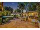 Wonderful outdoor dining area with tile patio, lush greenery, and exterior view of the home at 851 Georgia Ave, Winter Park, FL 32789