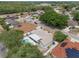 High angle full shot of a home with an in-ground pool, trees and surrounding neighborhood at 8520 Rose Groves Rd, Orlando, FL 32818