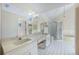 Large bathroom boasts double sinks, a separate shower, and a soaking tub at 8520 Rose Groves Rd, Orlando, FL 32818