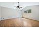 Large bedroom with hardwood floors, vaulted ceiling, and natural light from the window at 8520 Rose Groves Rd, Orlando, FL 32818