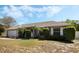 Charming single-story home with well-maintained landscaping and a two-car garage at 8520 Rose Groves Rd, Orlando, FL 32818