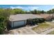 Lovely single-story home featuring a two-car garage, mature trees, and a beautifully landscaped yard at 8520 Rose Groves Rd, Orlando, FL 32818