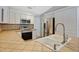 Bright kitchen featuring stainless steel appliances and tiled countertops at 8520 Rose Groves Rd, Orlando, FL 32818