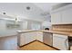 Open kitchen with stainless steel appliances and tiled countertops at 8520 Rose Groves Rd, Orlando, FL 32818