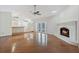 Bright living room featuring a fireplace and hardwood floors at 8520 Rose Groves Rd, Orlando, FL 32818