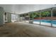 Enclosed porch area provides ample light to the pool, and is an ideal space for outdoor entertaining at 8520 Rose Groves Rd, Orlando, FL 32818