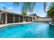 Sparkling swimming pool and screened lanai, perfect for outdoor living at 8520 Rose Groves Rd, Orlando, FL 32818