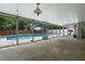 Enclosed porch area provides ample light to the pool, and is an ideal space for outdoor entertaining at 8520 Rose Groves Rd, Orlando, FL 32818