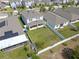 Aerial view of the home showing the fenced backyard and patio at 885 Carmillion Ct, Groveland, FL 34736