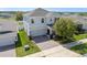 Beautiful two-story home with a two-car garage, and well-manicured lawn at 885 Carmillion Ct, Groveland, FL 34736