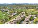 Aerial view featuring the property's location with golf course frontage, lake, and nearby trees at 10027 Hart Branch Cir, Orlando, FL 32832