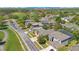 An aerial view of a neighborhood showing well-maintained homes, landscaping, and a golf course in the background at 10027 Hart Branch Cir, Orlando, FL 32832