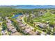 Aerial view shows the neighborhood's proximity to a lake, golf course, and a beautiful landscape at 10027 Hart Branch Cir, Orlando, FL 32832