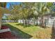 View of the backyard highlighting the privacy fence, mature landscaping and green space at 10027 Hart Branch Cir, Orlando, FL 32832