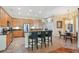 Bright kitchen featuring a breakfast bar with seating, stainless steel appliances, and ample cabinet space at 10027 Hart Branch Cir, Orlando, FL 32832