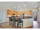 Spacious kitchen with ample cabinet space, stainless steel appliances, and a breakfast bar with seating at 10027 Hart Branch Cir, Orlando, FL 32832