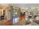 Comfortable living room with hardwood floors, a ceiling fan, and sliding glass doors offering backyard views at 10027 Hart Branch Cir, Orlando, FL 32832