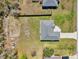 Overhead shot showing the home's roof and long driveway in a verdant, residential setting at 10367 Sw 45Th Ave, Ocala, FL 34476