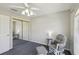 Comfortable bedroom featuring a cozy chair, plush carpet, and mirrored closet doors at 10367 Sw 45Th Ave, Ocala, FL 34476