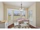 Bright dining area features a bay window and a white table with matching benches at 10367 Sw 45Th Ave, Ocala, FL 34476