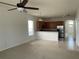 Bright living space featuring a ceiling fan and an open floor plan to the kitchen at 1352 Royal Saint George Dr, Orlando, FL 32828