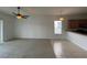 Open floorplan living room with tile/carpet combo and view to the kitchen and eat-in bar at 1352 Royal Saint George Dr, Orlando, FL 32828