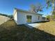 Home exterior view highlighting the backyard and patio area at 137 W G H Washington St, Apopka, FL 32703