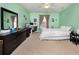 Serene bedroom features a desk area and ample space, bathed in light at 14316 Fredricksburg Dr # 507, Orlando, FL 32837
