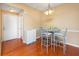 Cozy dining area with wood floors, a modern light fixture, and seating for four at 14316 Fredricksburg Dr # 507, Orlando, FL 32837